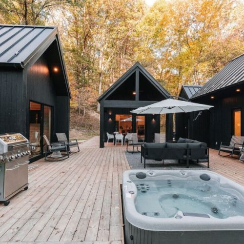 Welcome to your deconstructed villa! Villa Pine featuring four structures - Eat & Play, Heat (Sauna) and two Rest & Refresh, connected by over 900 sqft of decking, including hot tub, fire pit, and EV charging.