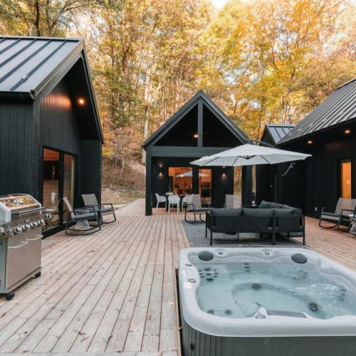 Welcome to your deconstructed villa! Villa Pine featuring four structures - Eat & Play, Heat (Sauna) and two Rest & Refresh, connected by over 900 sqft of decking, including hot tub, fire pit, and EV charging.