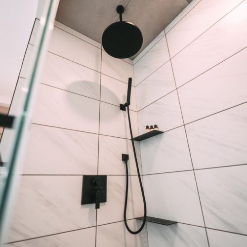 Shower features rain shower and wand with heated exhaust.