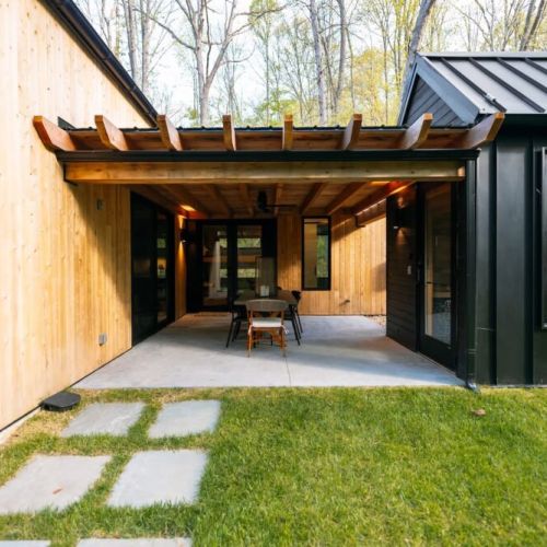 Covered Patio with ceiling fan connecting your private sauna and path way to the fire pit.