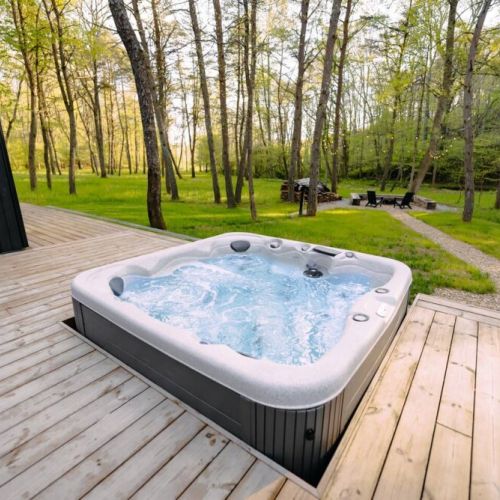 Recessed Masterspa Getaway Hot Tub overlooking the Pine forest.